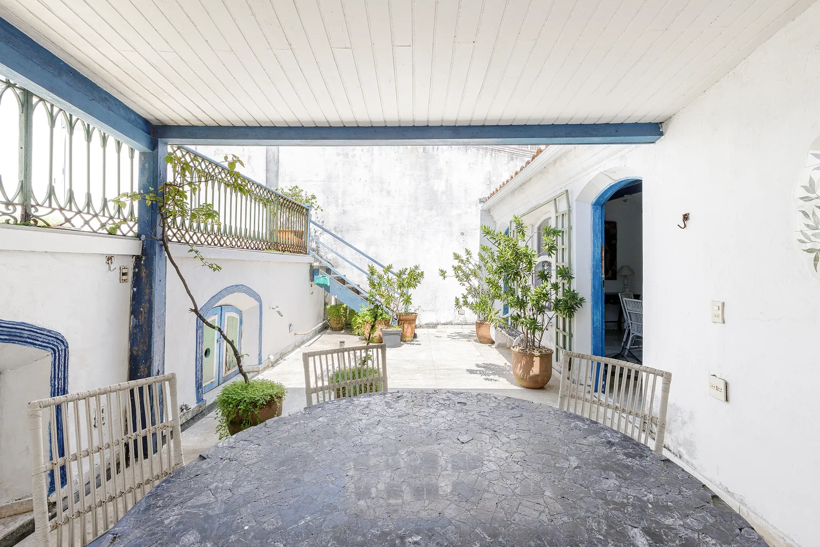 A covered walkway across the roof, open to the terraces